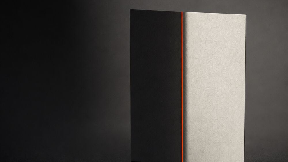 One blank rectangle split down the middle, half in deep shadow and half hard-lit, divided by an orange strip.